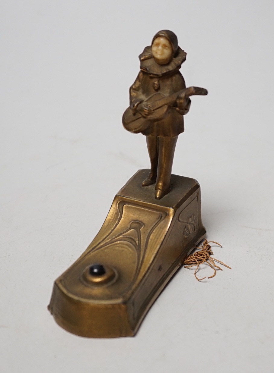 An Art Deco violin player bell with ivory face inset 9.5cm